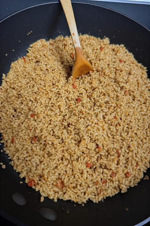 Rice stirred into ground turkey filling before stuffing bell peppers