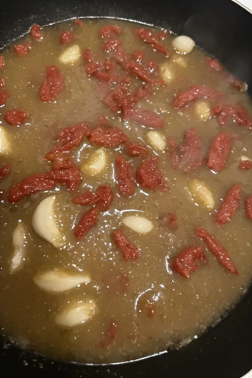 Chicken broth added to skillet building the marry me chicken sauce