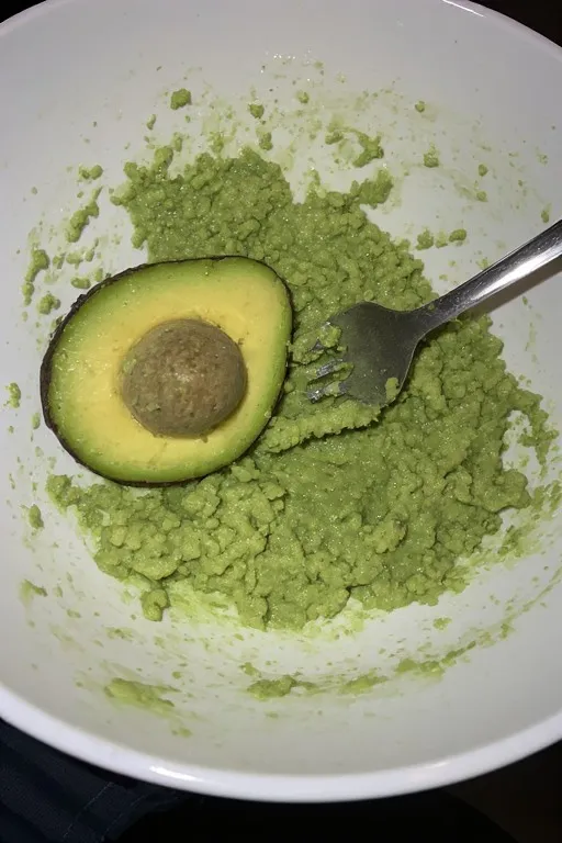 Mashed avocado in a bowl.