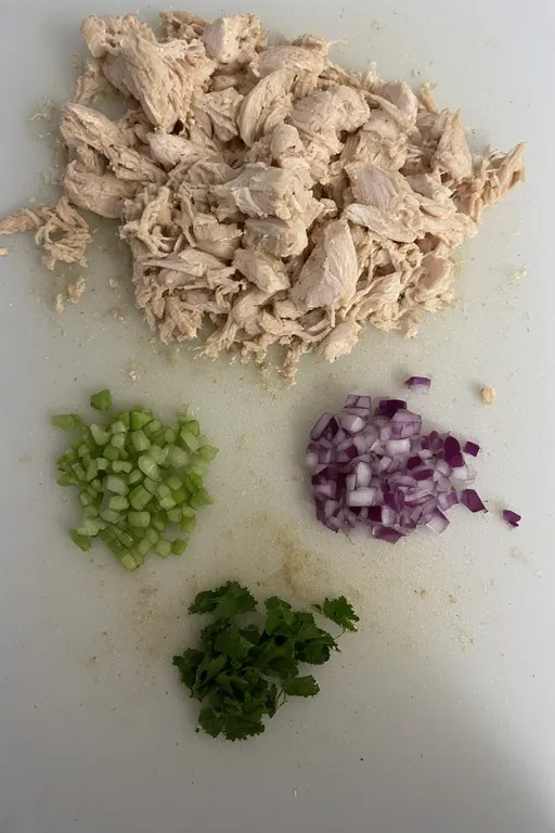 Shredded chicken and chopped vegetables.