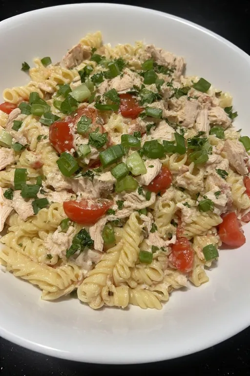 Finished chicken pasta salad in a serving bowl ready to eat
