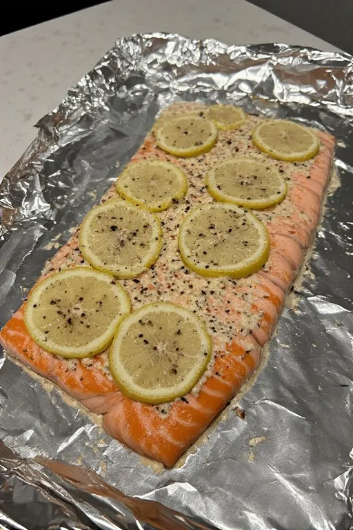 Boursin salmon with lemon ready to bake in oven