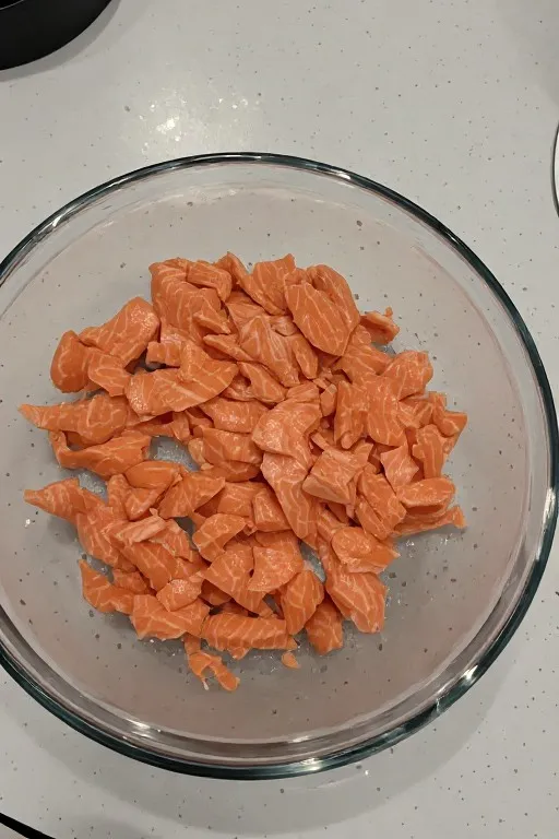 Flaked canned salmon in mixing bowl for canned salmon patties recipe