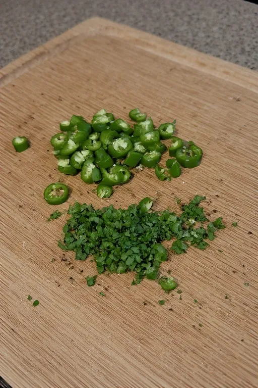 Fresh jalapeño and cilantro prepped for spicy mango slaw recipe