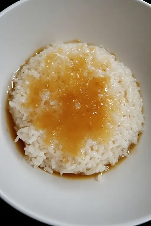  Coconut sauce mixed into warm sticky rice for mango dessert
