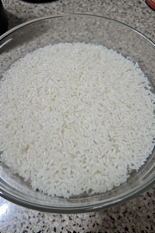 Glutinous rice soaking in water for mango sticky rice dessert recipe