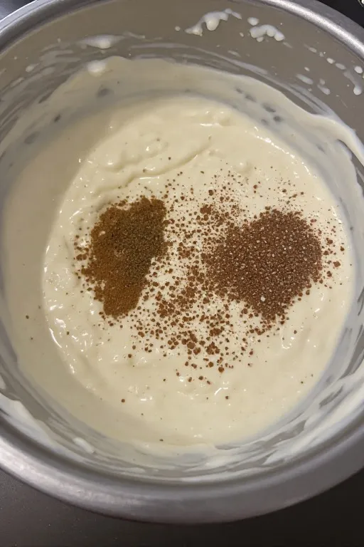 Creamy base mixed together in bowl for Mexican street corn dip