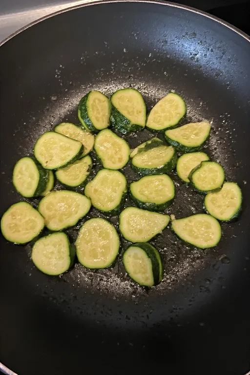  Golden sautéed zucchini in skillet for tomato zucchini pasta