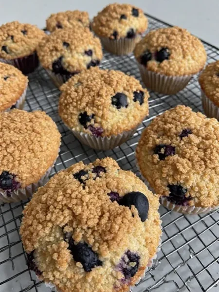 Best blueberry muffins with streusel topping cooling on wire rack
