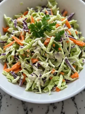 Homemade coleslaw served in bowl at summer table ready to eat
