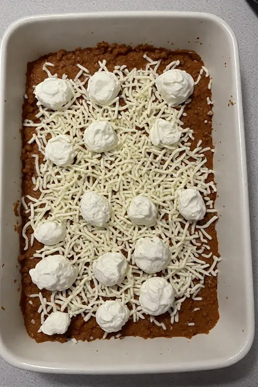 Best lasagna recipe fresh from oven with golden bubbly cheese top